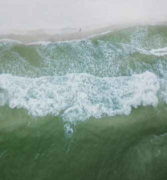 a person riding a surfboard on a wave in the ocean